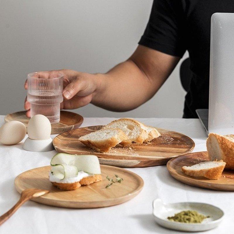 Acacia cutting board with bread